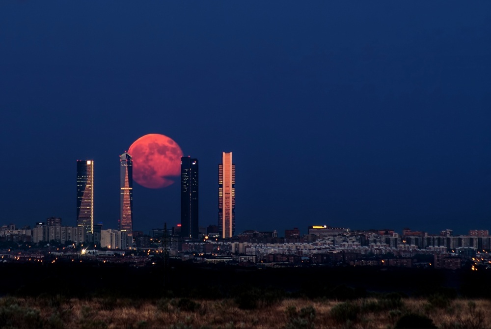 Moon rising above Madrid, Spain