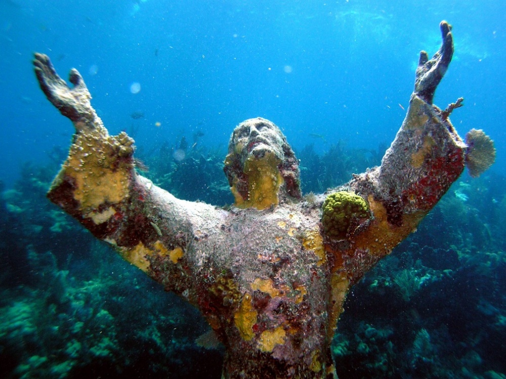 A Statue of Christ covered with corals at the bottom of the Atlantic near Key Largo island, USA